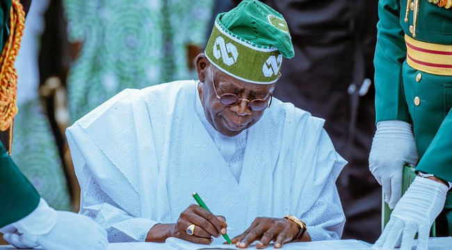 President Bola Tinubu signs the ₦55.99 trillion 2025 budget into law at the Presidential Villa, Abuja, marking a crucial step in Nigeria’s economic planning