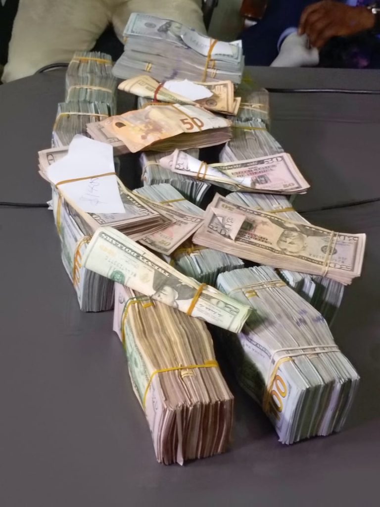 Seized $578,000 in undeclared cash displayed by Nigeria Customs officers at Murtala Muhammed International Airport.
