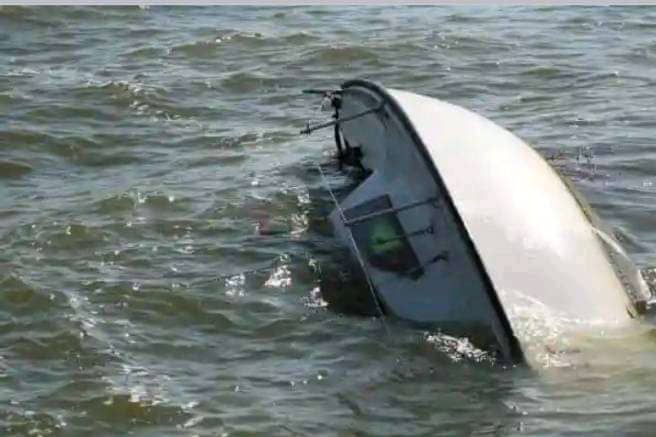 Seven Dead, Including Children, as Migrant Boat Capsizes Near Greek Island 5 A capsized boat floating in rough waters, illustrating the tragic migrant boat accident off the coast of Lesbos, Greece, where at least seven people lost their lives.